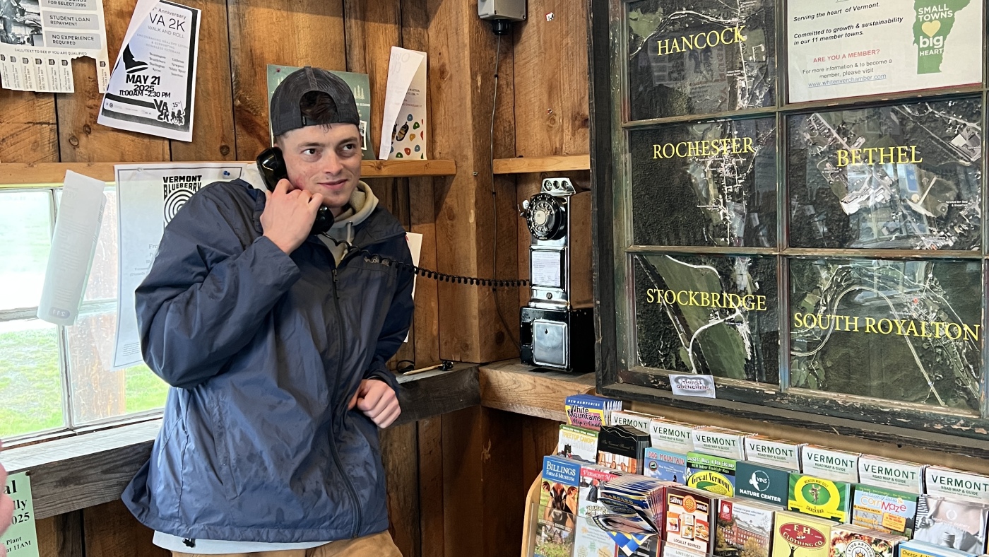 An engineer restores pay phones for free public use